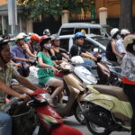 A crowd of motorcyclists on a Vietnamese street