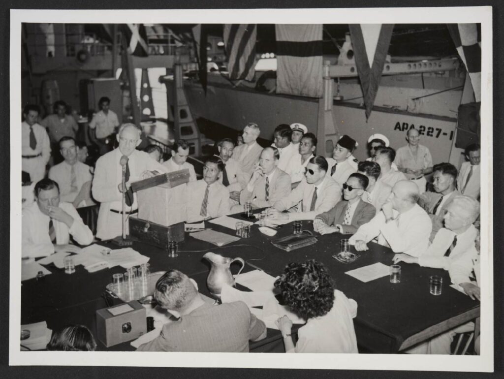 Dr. Frank addressing the negotiating sides aboard the USS Renville in December 1947
